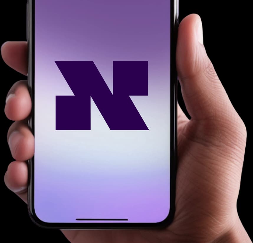 Hand holding phone showing Niftipay app